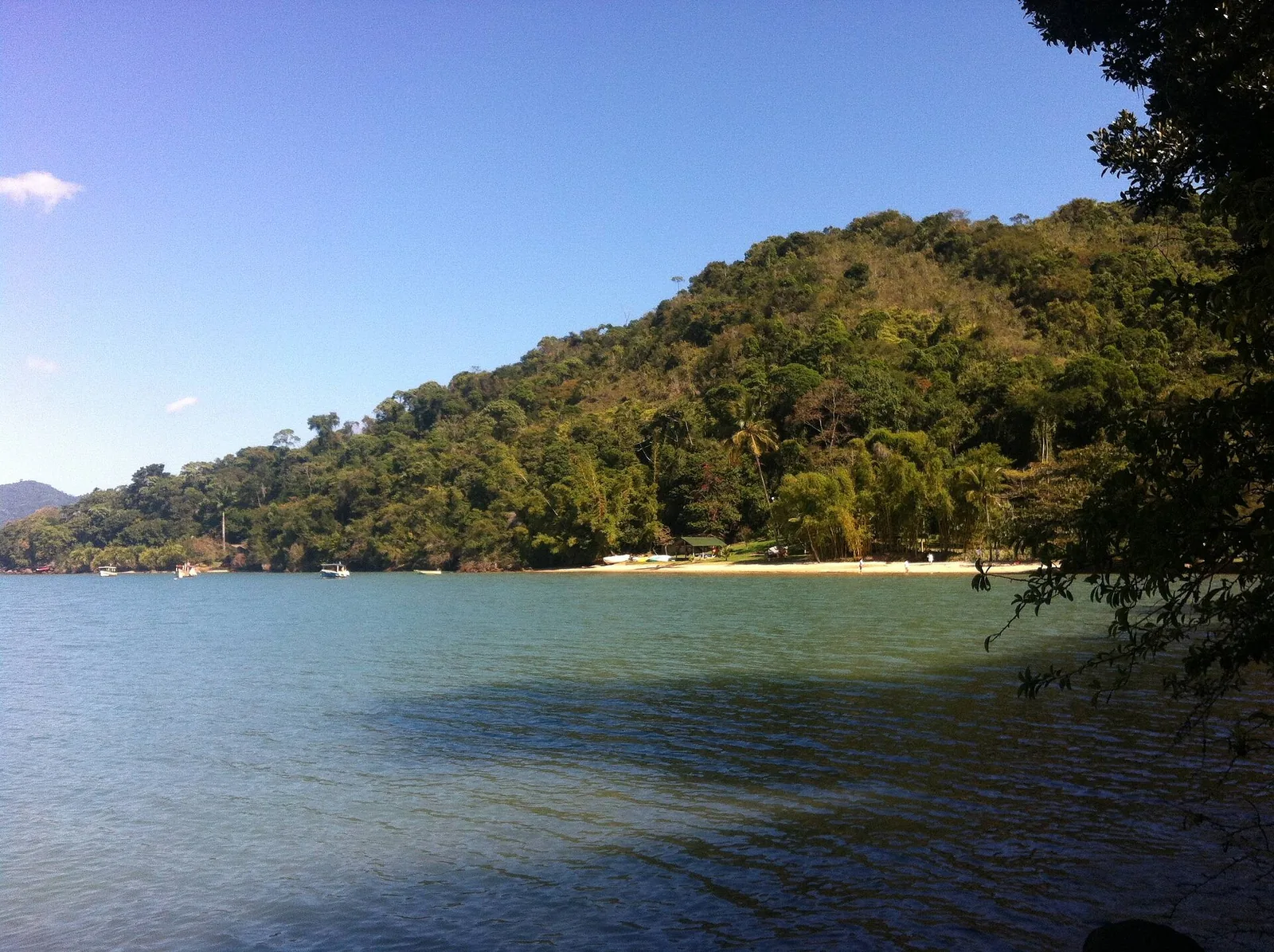 A beach deep in the Mamanguá inlet, where the rhythm of life still follows the tide and the catch.