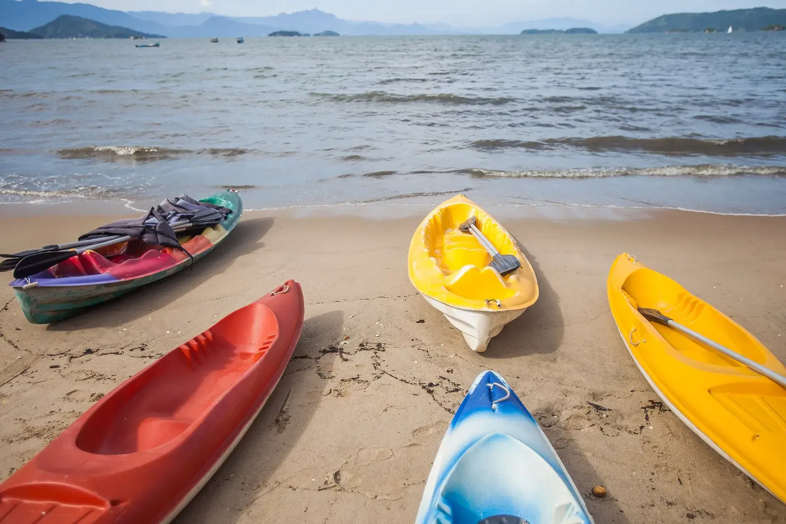 Kayaks on the sand at Praia do Pontal, the beach just across the river from the historic center.