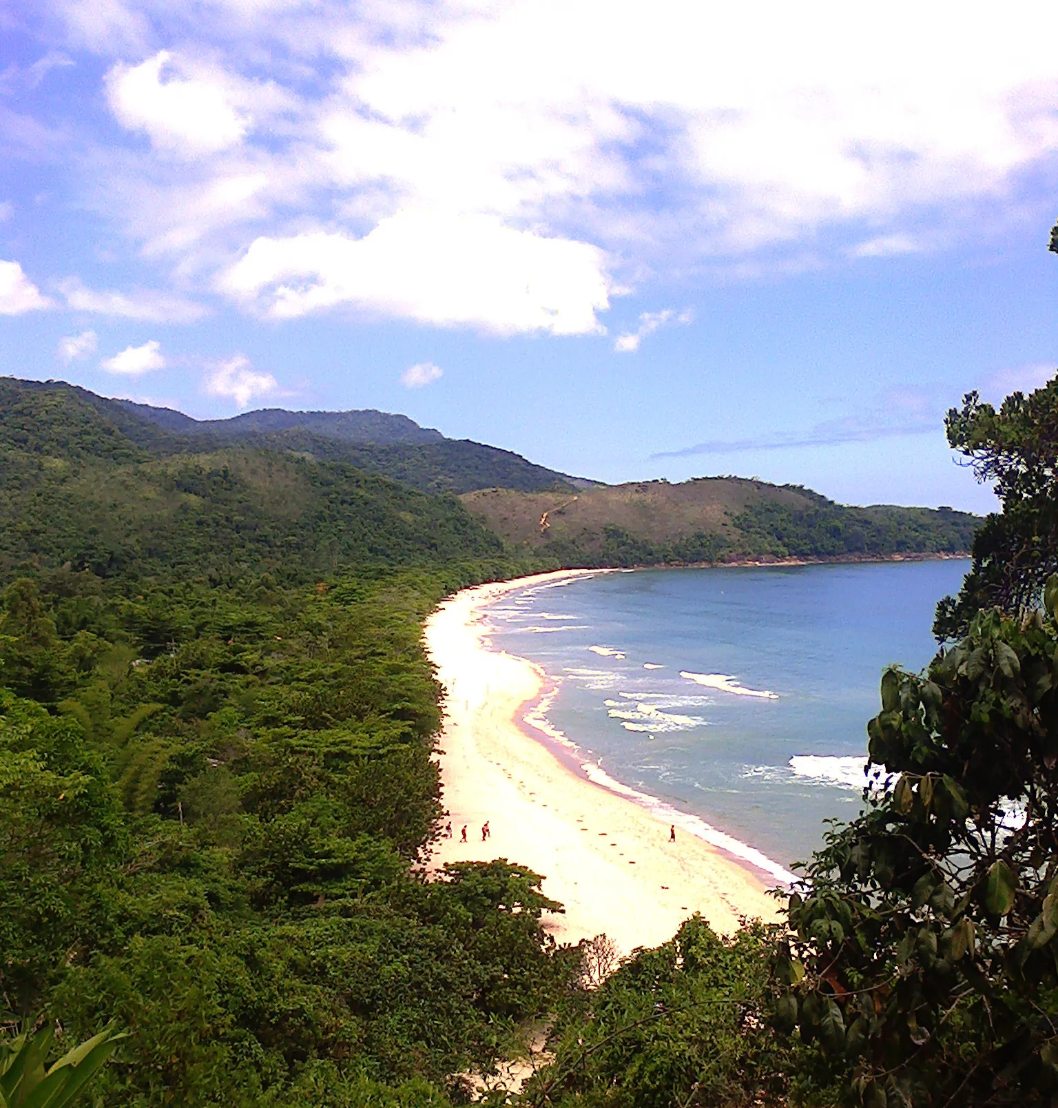 Calm, clear water at the sheltered end of the beach, the safest place for an easy swim.